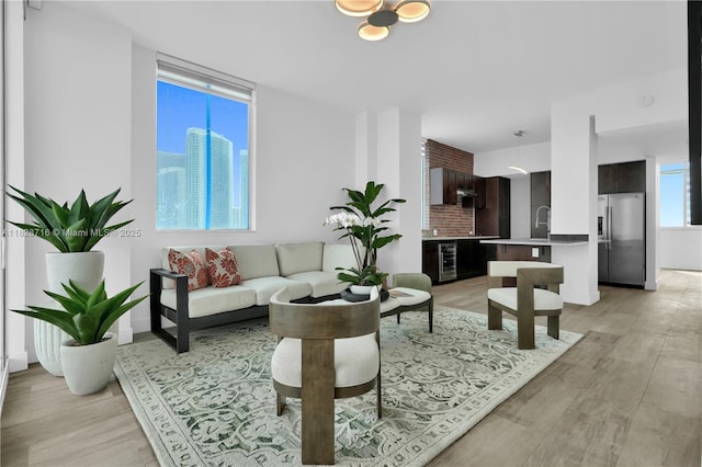 725 NE 22nd St Unit 16A, Miami, FL 33137 - living area with light wood finished floors and beverage cooler