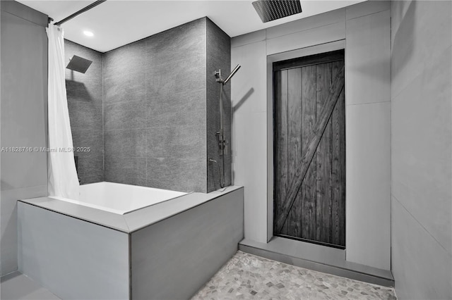 725 NE 22nd St Unit 16A, Miami, FL 33137 - bathroom featuring a tile shower and recessed lighting