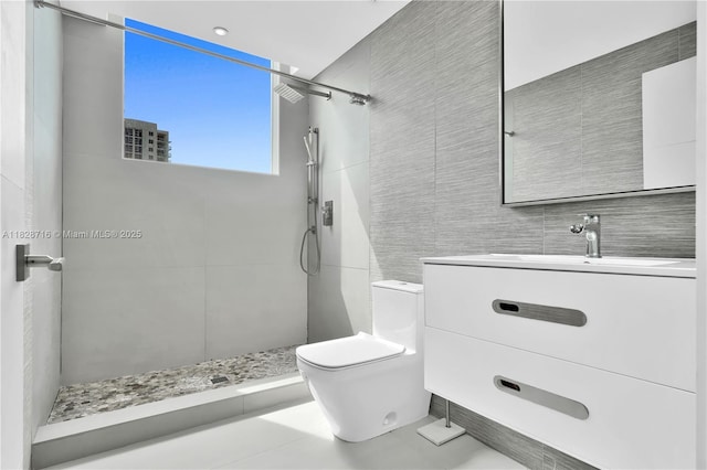 725 NE 22nd St Unit 16A, Miami, FL 33137 - full bathroom with a tile shower, vanity, and tile walls