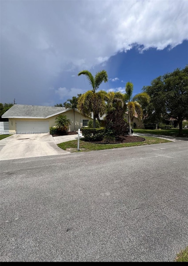 14603 SW 152nd Ct, Miami, FL 33196 - view of front of home featuring concrete driveway and a garage