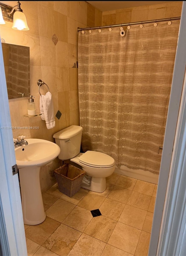 14603 SW 152nd Ct, Miami, FL 33196 - bathroom with tile walls and a shower with shower curtain
