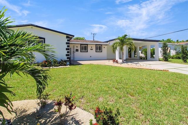 7460 NW 1st Ct, Pembroke Pines, FL 33024 - view of front of house with driveway, stucco siding, a front yard, and an attached carport
