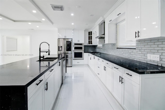 7460 NW 1st Ct, Pembroke Pines, FL 33024 - kitchen with appliances with stainless steel finishes, recessed lighting, wall chimney exhaust hood, decorative backsplash, and white cabinetry