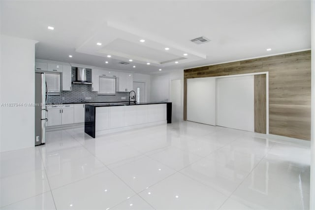 7460 NW 1st Ct, Pembroke Pines, FL 33024 - kitchen with wall chimney exhaust hood, a tray ceiling, freestanding refrigerator, white cabinets, and recessed lighting