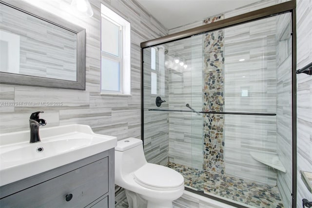7460 NW 1st Ct, Pembroke Pines, FL 33024 - bathroom with a shower stall, vanity, and tile walls