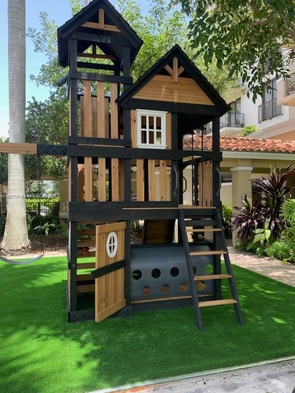 8430 SW 8th St Unit 606B, Miami, FL 33144 - view of playground with a yard