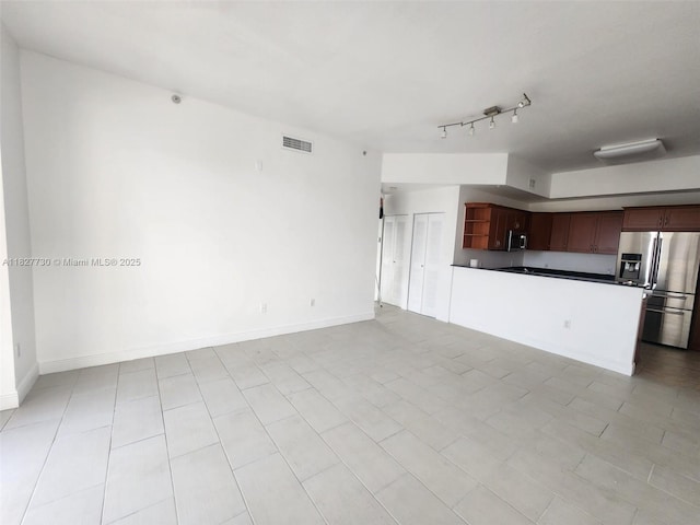 8430 SW 8th St Unit 606B, Miami, FL 33144 - unfurnished living room featuring baseboards