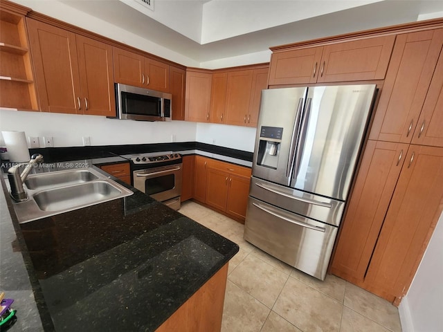 8430 SW 8th St Unit 606B, Miami, FL 33144 - kitchen featuring appliances with stainless steel finishes, open shelves, brown cabinets, light tile patterned floors, and dark stone countertops