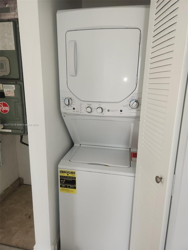 8430 SW 8th St Unit 606B, Miami, FL 33144 - laundry area with stacked washer / drying machine and tile patterned floors