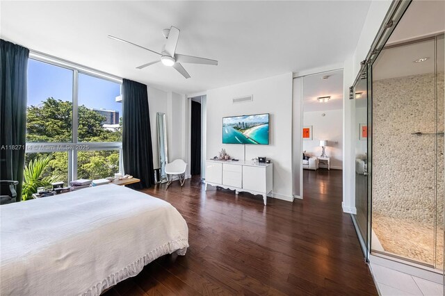 720 NE 62nd St Unit 403, Miami, FL 33138 - bedroom featuring wood finished floors, a wall of windows, and a ceiling fan