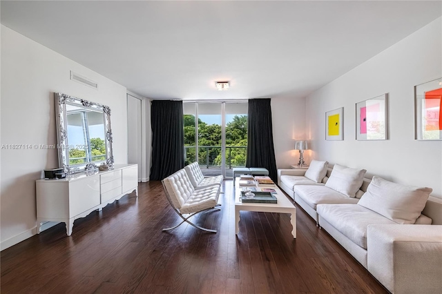 720 NE 62nd St Unit 403, Miami, FL 33138 - living room featuring plenty of natural light and dark wood finished floors