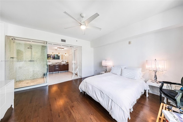 720 NE 62nd St Unit 403, Miami, FL 33138 - bedroom with wood finished floors, connected bathroom, and ceiling fan