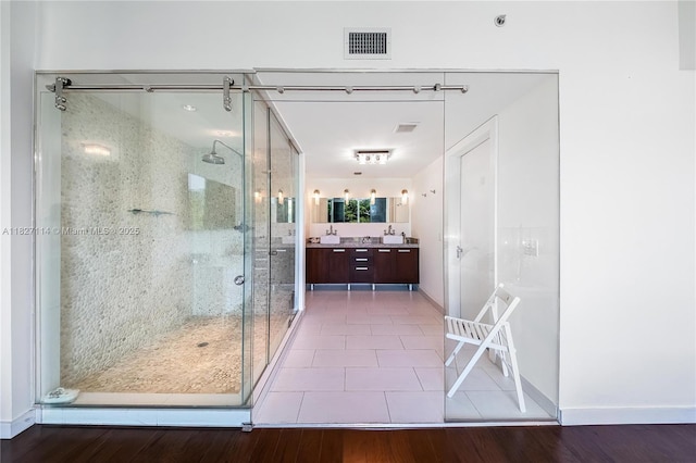 720 NE 62nd St Unit 403, Miami, FL 33138 - full bath with a shower stall, double vanity, and wood finished floors