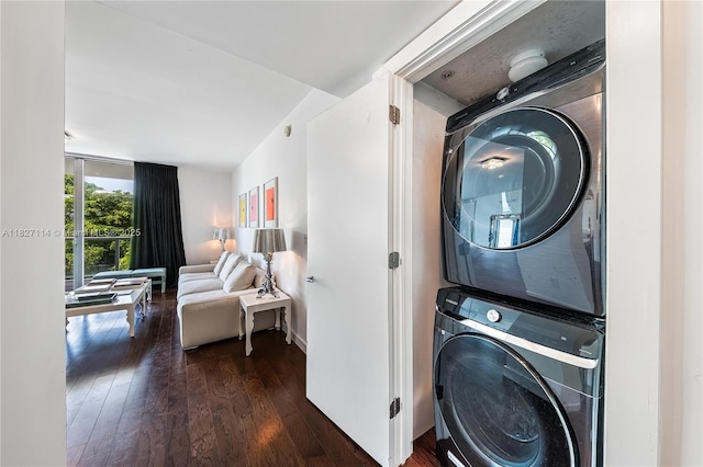 720 NE 62nd St Unit 403, Miami, FL 33138 - washroom featuring stacked washer / dryer and dark wood-style floors