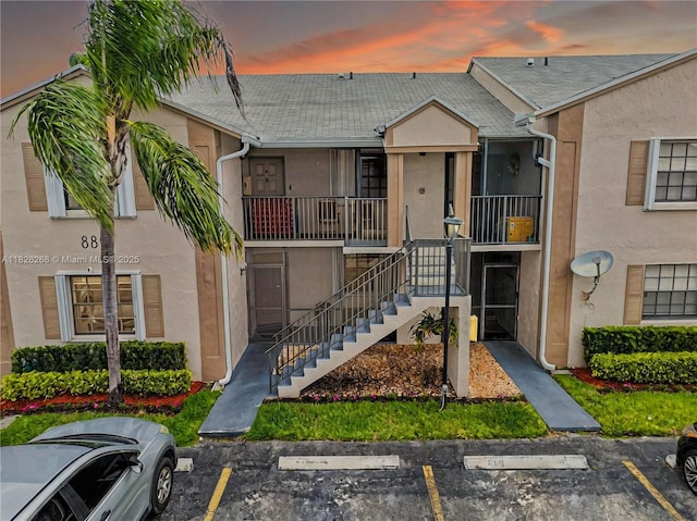 889 Hamilton Dr Unit 889B, Homestead, FL 33034 - view of building exterior featuring uncovered parking and stairs
