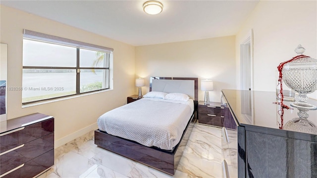 889 Hamilton Dr Unit 889B, Homestead, FL 33034 - bedroom with light marble finish floors and baseboards
