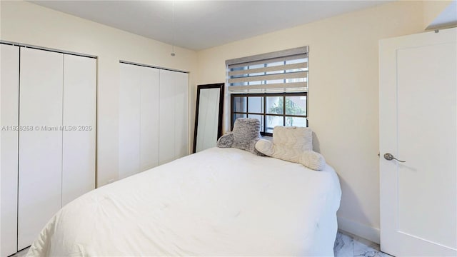 889 Hamilton Dr Unit 889B, Homestead, FL 33034 - bedroom featuring two closets and light marble finish flooring