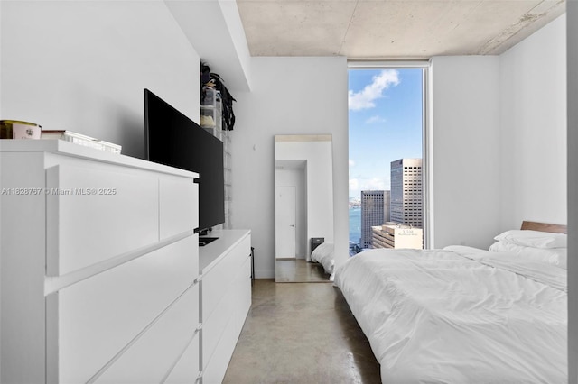151 SE 1st St Unit 3102, Miami, FL 33131 - bedroom with finished concrete flooring and a wall of windows