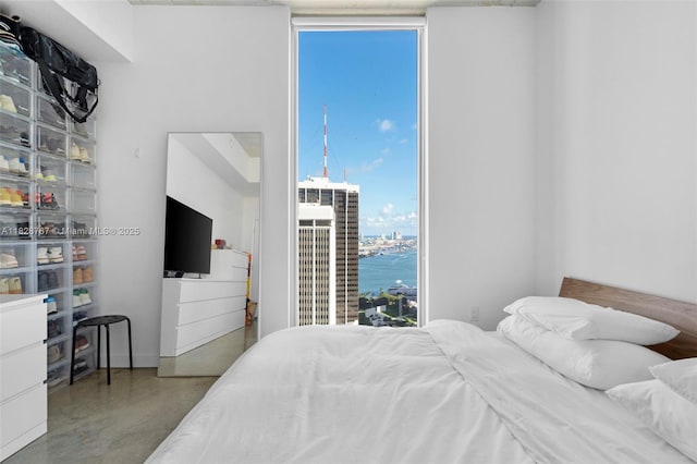 151 SE 1st St Unit 3102, Miami, FL 33131 - bedroom featuring floor to ceiling windows and concrete flooring