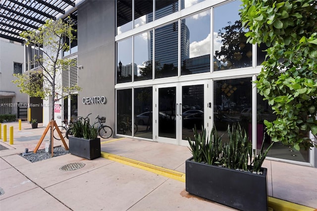 151 SE 1st St Unit 3102, Miami, FL 33131 - entrance to property with french doors, a pergola, and a patio