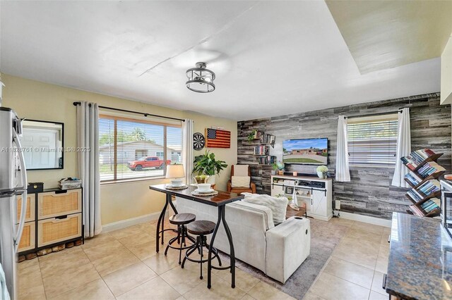 2435 Wilson St, Hollywood, FL 33020 - living room featuring an accent wall, plenty of natural light, and light tile patterned floors