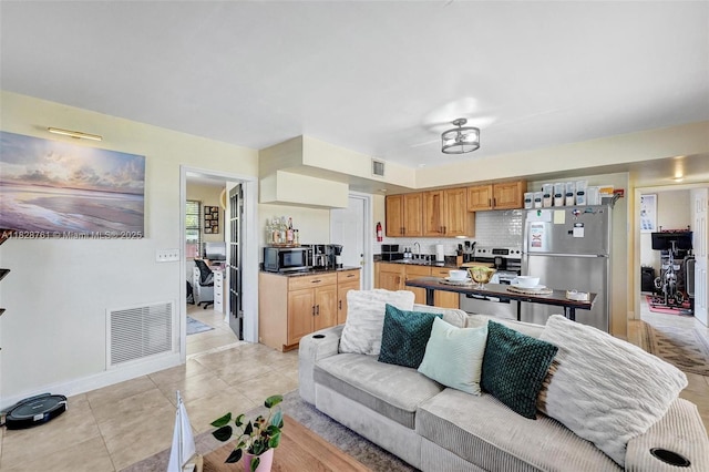 2435 Wilson St, Hollywood, FL 33020 - living area with light tile patterned flooring and baseboards