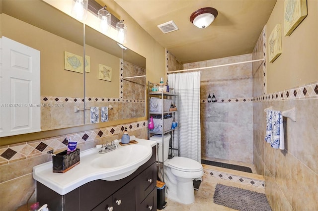 2435 Wilson St, Hollywood, FL 33020 - full bath featuring tile walls, vanity, a tile shower, and tile patterned flooring