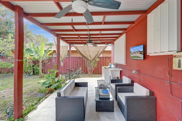 2435 Wilson St, Hollywood, FL 33020 - fenced backyard featuring a ceiling fan, outdoor lounge area, and a patio area