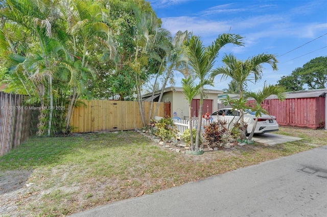 2435 Wilson St, Hollywood, FL 33020 - view of side of property with a gate and stucco siding