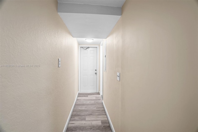 212 SW 11th St, Dania Beach, FL 33004 - hall with wood finished floors and a textured wall