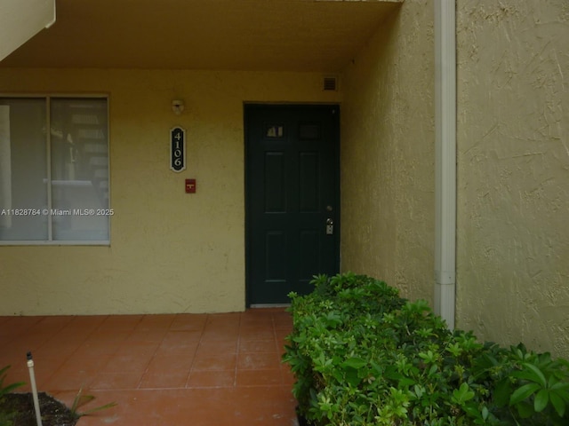 4106 Glenmoor Dr Unit 0, West Palm Beach, FL 33409 - entrance to property featuring stucco siding