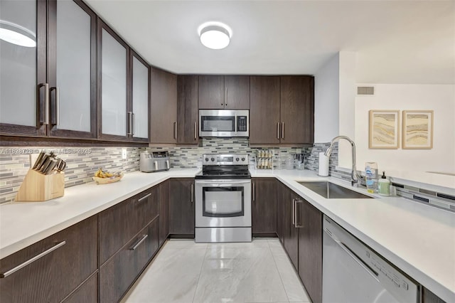 9255 SW 125th Ave Unit 108R, Miami, FL 33186 - kitchen featuring stainless steel appliances, light countertops, and tasteful backsplash
