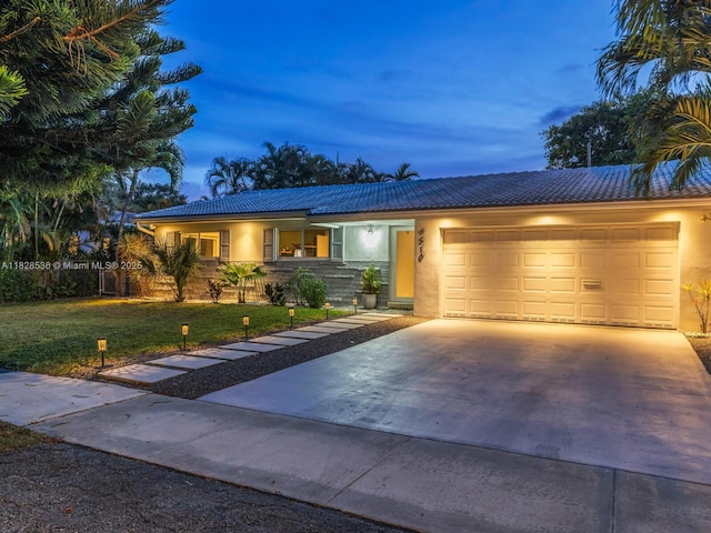 9510 NW 1st Ave, Miami Shores, FL 33150 - single story home featuring a tiled roof, a garage, stucco siding, driveway, and a front lawn