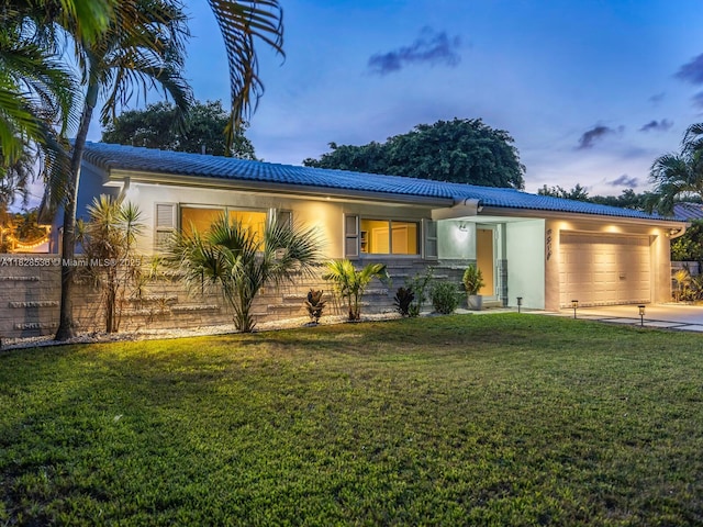 9510 NW 1st Ave, Miami Shores, FL 33150 - single story home with an attached garage, driveway, stucco siding, and a front lawn