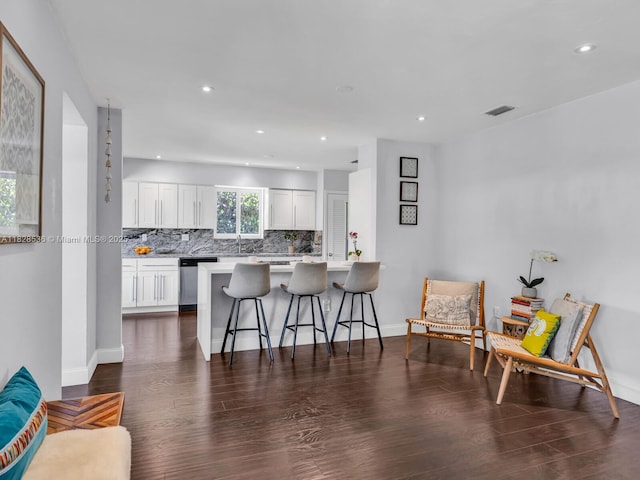 9510 NW 1st Ave, Miami Shores, FL 33150 - kitchen featuring stainless steel dishwasher, a peninsula, tasteful backsplash, dark wood finished floors, and recessed lighting