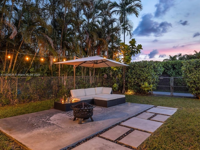 9510 NW 1st Ave, Miami Shores, FL 33150 - fenced backyard with a patio area and an outdoor living space with a fire pit