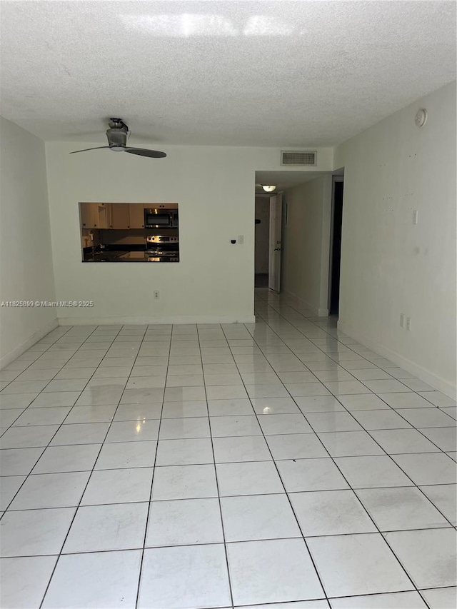10000 NW 80th Ct Unit 2151, Hialeah Gardens, FL 33016 - unfurnished room featuring a textured ceiling, a ceiling fan, and light tile patterned flooring
