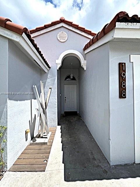 1988 SE 12th St, Homestead, FL 33035 - hall with light tile patterned floors
