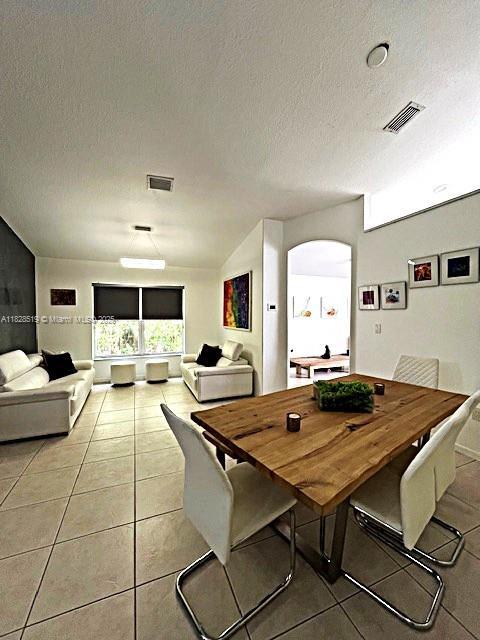 1988 SE 12th St, Homestead, FL 33035 - dining area with light tile patterned floors