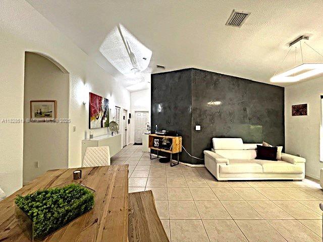 1988 SE 12th St, Homestead, FL 33035 - living room with light tile patterned flooring and baseboards