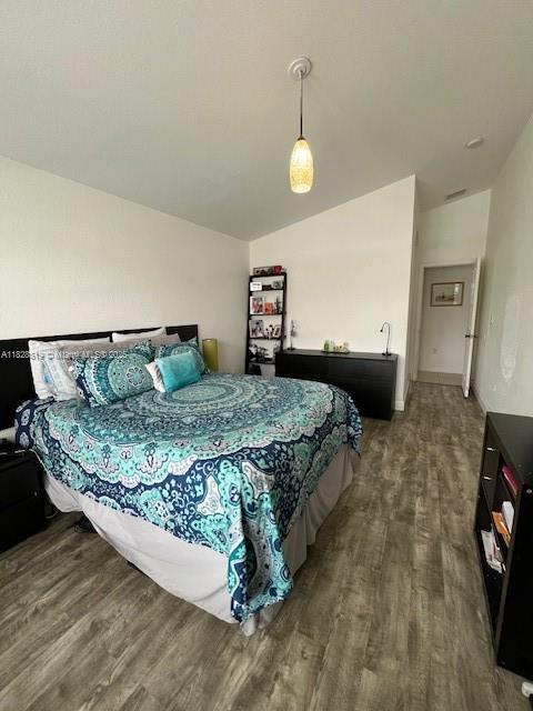 1988 SE 12th St, Homestead, FL 33035 - bedroom featuring dark wood finished floors and baseboards