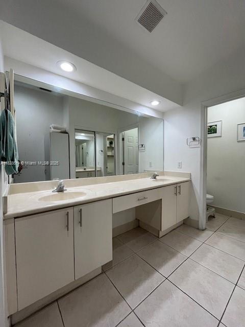 1988 SE 12th St, Homestead, FL 33035 - bathroom featuring tile patterned flooring and a textured ceiling