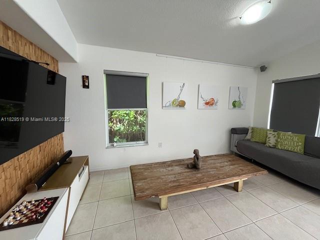 1988 SE 12th St, Homestead, FL 33035 - living room with light tile patterned flooring