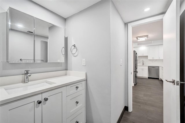 600 Three Islands Blvd Unit 1016, Hallandale Beach, FL 33009 - bathroom featuring vanity, wood finished floors, and recessed lighting