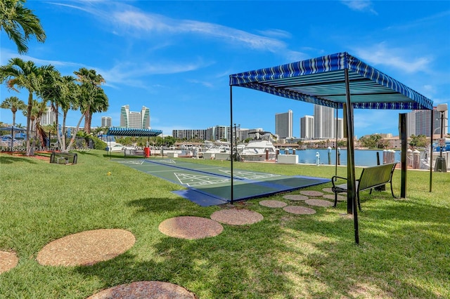 600 Three Islands Blvd Unit 1016, Hallandale Beach, FL 33009 - view of home's community featuring shuffleboard, a yard, and a city view