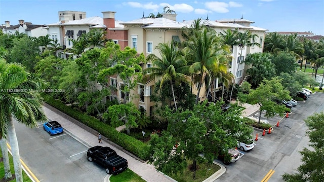 3055 NW 126th Ave Unit 107, Sunrise, FL 33323 - view of building exterior featuring uncovered parking