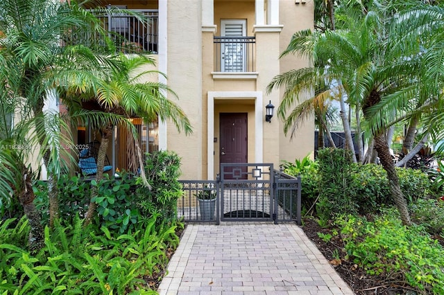 3055 NW 126th Ave Unit 107, Sunrise, FL 33323 - property entrance featuring stucco siding and a gate
