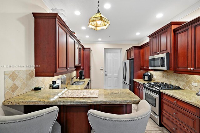 3055 NW 126th Ave Unit 107, Sunrise, FL 33323 - kitchen with stainless steel appliances, dark brown cabinets, backsplash, pendant lighting, and recessed lighting