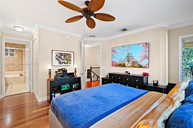 3055 NW 126th Ave Unit 107, Sunrise, FL 33323 - bedroom with wood finished floors, crown molding, ceiling fan, and ensuite bath