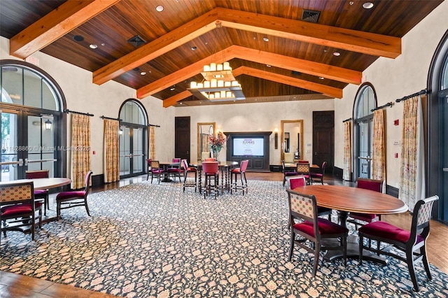 3055 NW 126th Ave Unit 107, Sunrise, FL 33323 - dining space featuring french doors, a wooden ceiling with exposed beams, high vaulted ceiling, wood finished floors, and recessed lighting